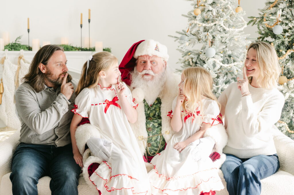 Light and airy family holiday portrait with Santa Claus in a minimalist studio setting in Milton, serving families throughout the Atlanta area.